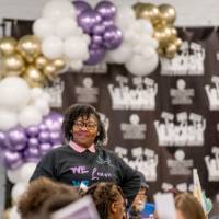 Girls of Color Summit previous event with a speaker smiling at the audience